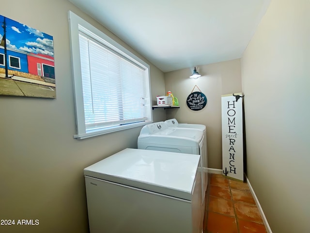 laundry area featuring laundry area, baseboards, and separate washer and dryer