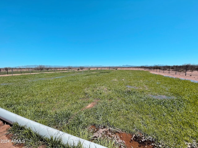 view of yard with a rural view