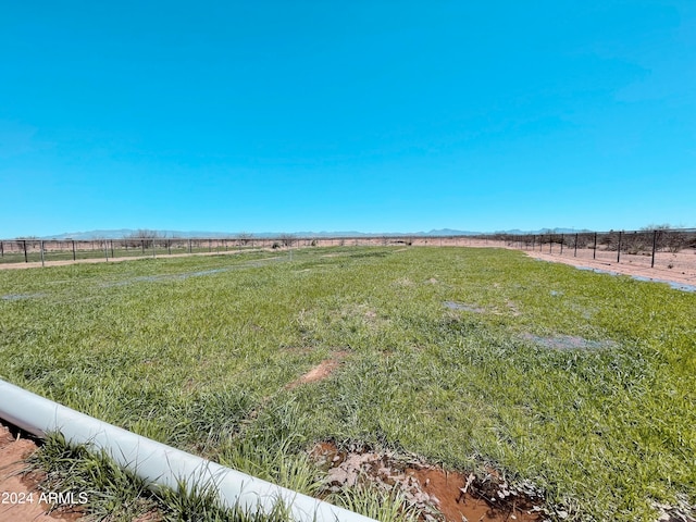 view of yard with a rural view