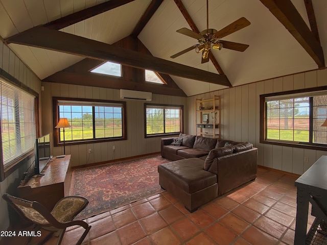 living room featuring tile patterned flooring, lofted ceiling with beams, a wall mounted air conditioner, and ceiling fan