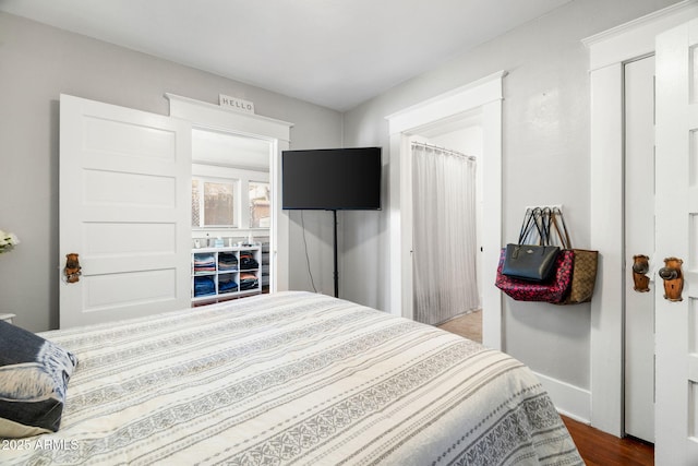 bedroom with wood finished floors