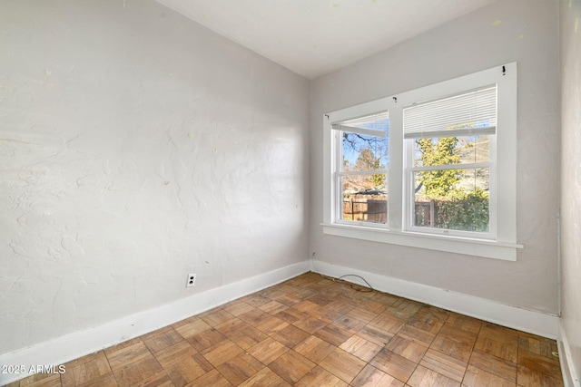empty room with baseboards