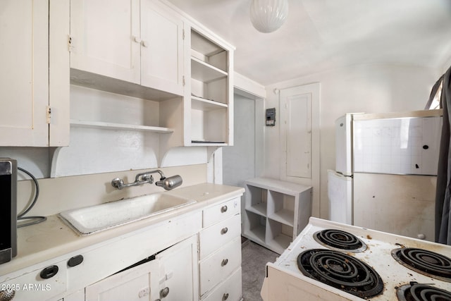 kitchen featuring white appliances, a sink, white cabinets, light countertops, and open shelves