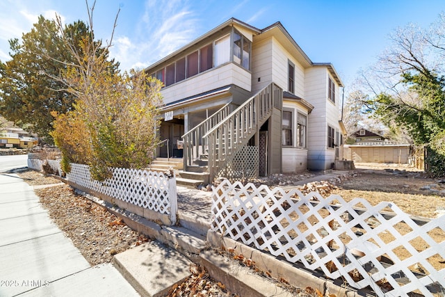 exterior space featuring a fenced front yard