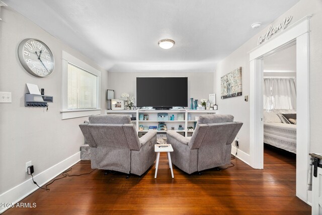 living room with wood finished floors and baseboards