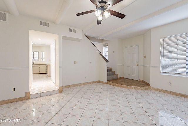 1446 E Grovers Ave Unit 13, Phoenix, AZ 85022 - unfurnished living room featuring beam ceiling, light tile patterned floors, a ceiling fan, and stairway