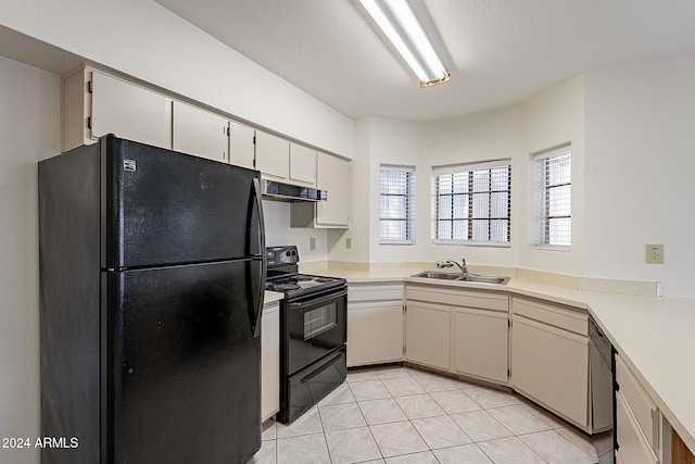 1446 E Grovers Ave Unit 13, Phoenix, AZ 85022 - kitchen with black appliances, extractor fan, light countertops, and light tile patterned floors