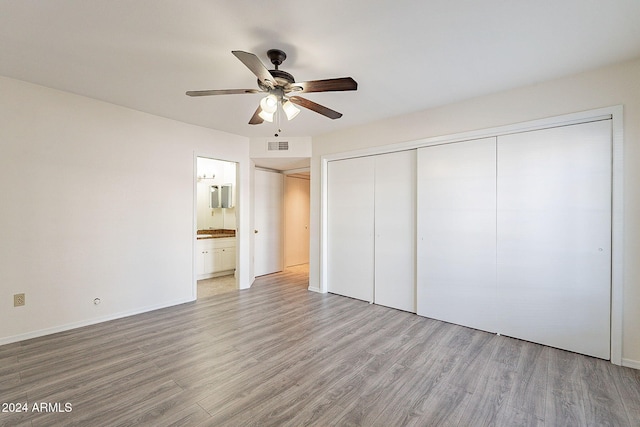1446 E Grovers Ave Unit 13, Phoenix, AZ 85022 - unfurnished bedroom featuring light wood-style flooring, a closet, ensuite bath, and a ceiling fan