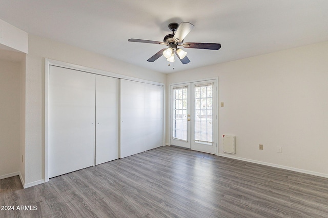 1446 E Grovers Ave Unit 13, Phoenix, AZ 85022 - unfurnished bedroom featuring wood finished floors, a closet, ceiling fan, and access to exterior