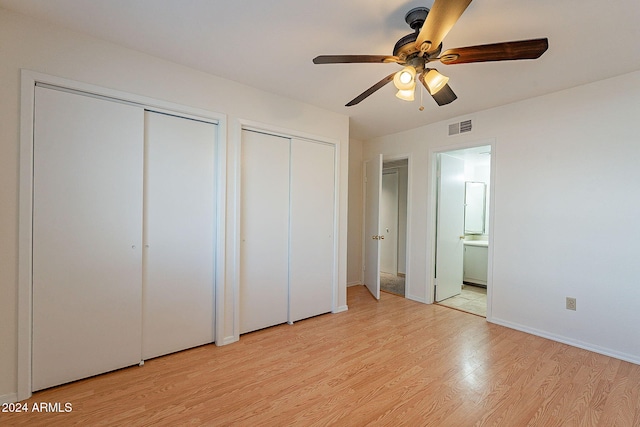 1446 E Grovers Ave Unit 13, Phoenix, AZ 85022 - unfurnished bedroom with multiple closets, light wood-type flooring, ensuite bathroom, and a ceiling fan