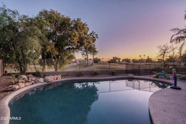 view of pool featuring a patio area, fence, and a fenced in pool