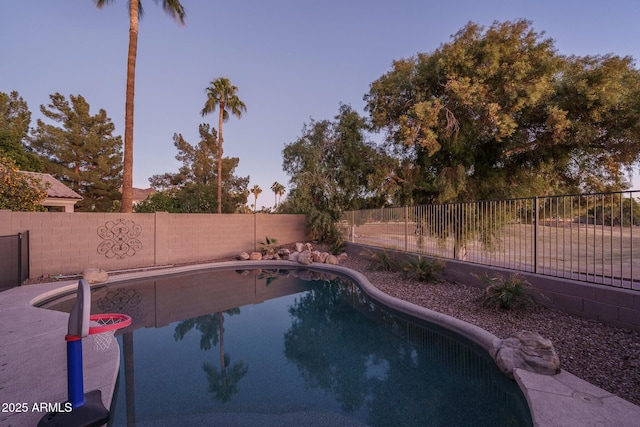 view of pool featuring a fenced backyard and a fenced in pool