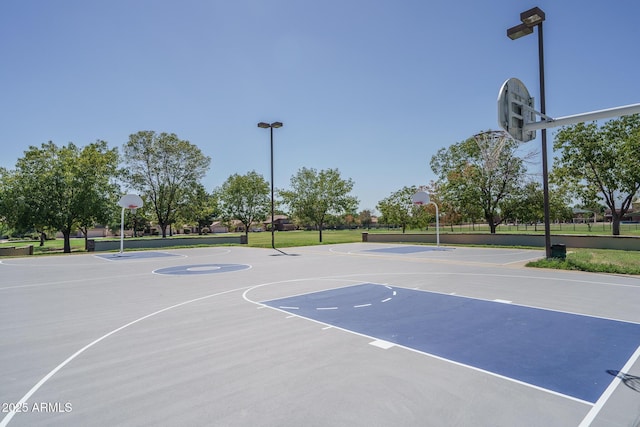 view of sport court with community basketball court and a lawn