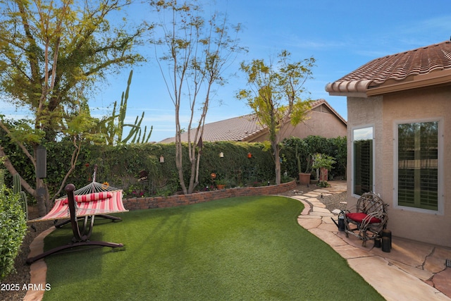 view of yard with a patio and fence