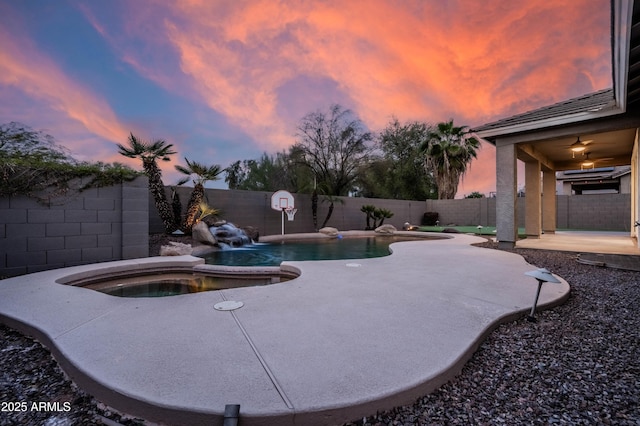 view of swimming pool featuring an in ground hot tub, a patio area, a fenced backyard, and a fenced in pool