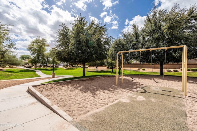 surrounding community featuring playground community and a lawn