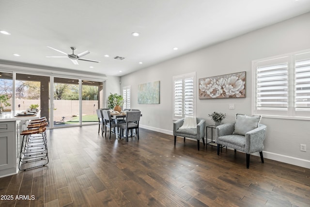 dining room with baseboards, dark wood-type flooring, visible vents, and recessed lighting