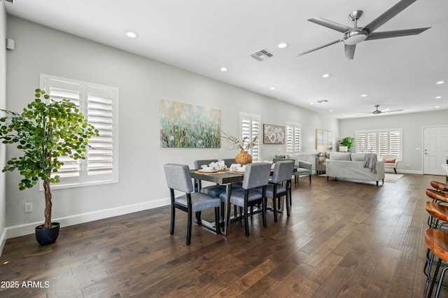 dining area featuring dark wood-style flooring, plenty of natural light, and recessed lighting