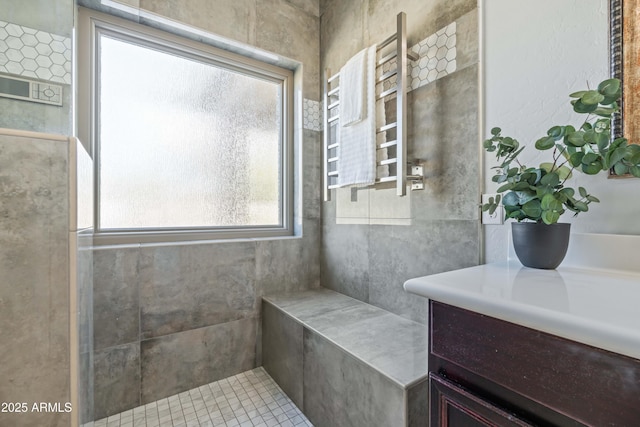 bathroom featuring radiator heating unit and vanity