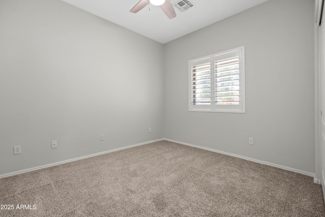 unfurnished room with baseboards, carpet flooring, visible vents, and a ceiling fan