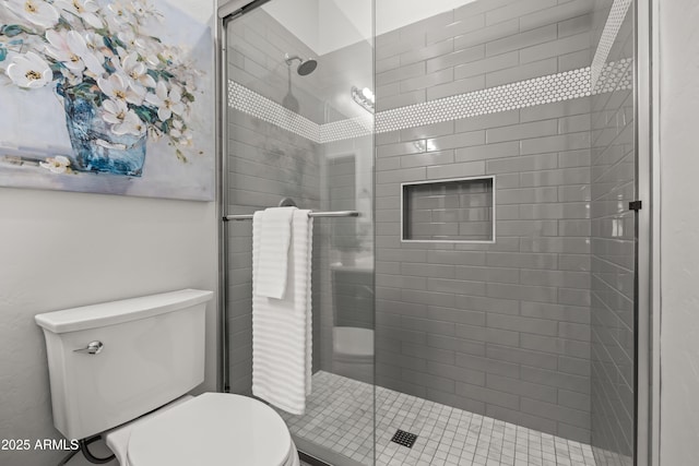 full bathroom with a stall shower and toilet