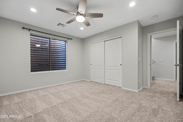 unfurnished bedroom with recessed lighting, visible vents, baseboards, a closet, and carpet