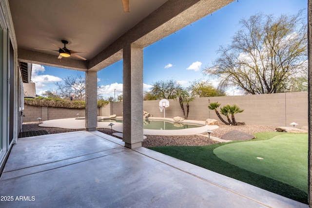 view of patio with a fenced backyard and ceiling fan