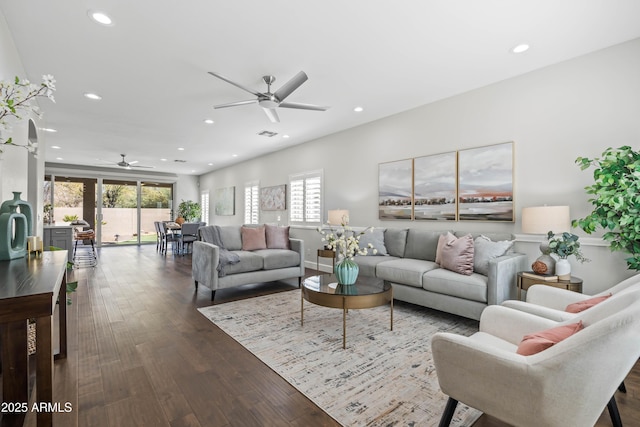 living room with ceiling fan, dark wood-type flooring, and recessed lighting