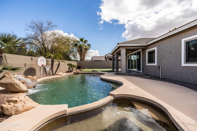 view of swimming pool featuring a patio area, a fenced backyard, and a fenced in pool