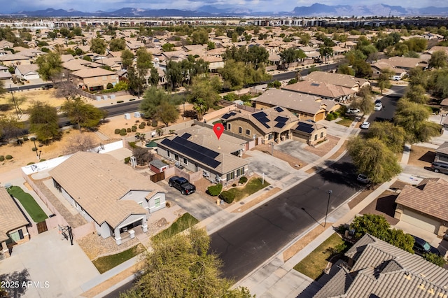 birds eye view of property with a mountain view and a residential view