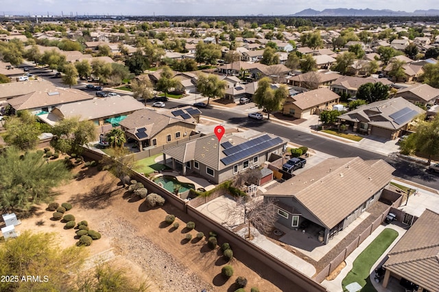 birds eye view of property with a residential view