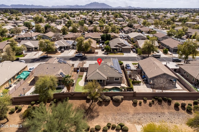 drone / aerial view featuring a residential view and a mountain view