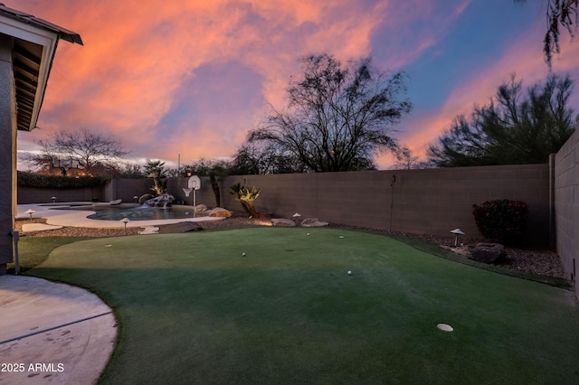 view of yard with a patio area and a fenced backyard