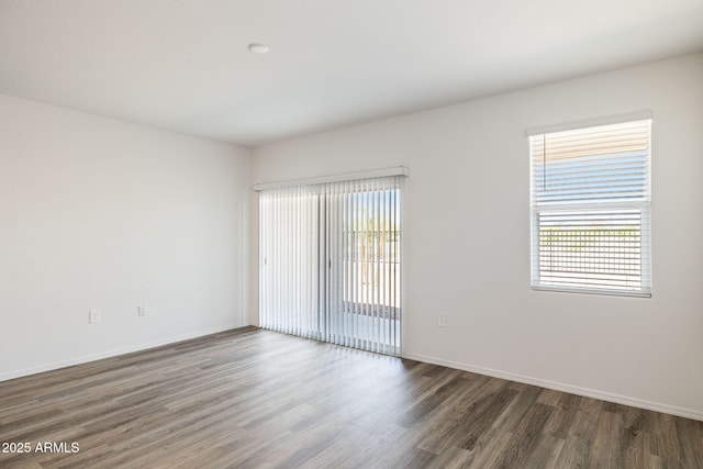 18362 W Hackamore Dr, Wittmann, AZ 85361 - empty room with wood finished floors and baseboards