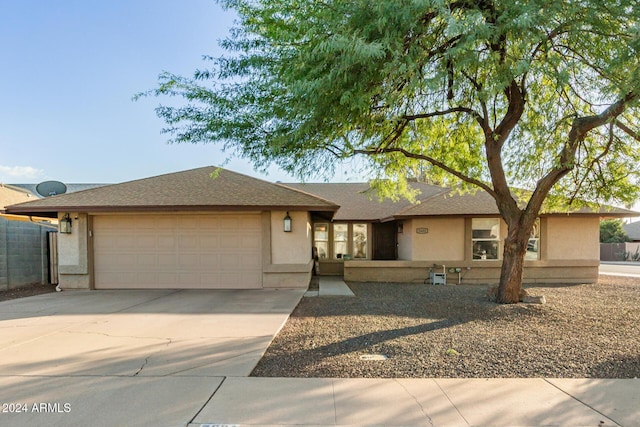 single story home featuring a garage