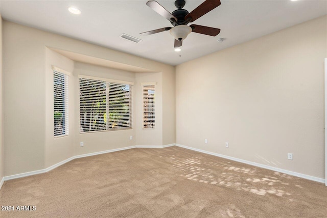 carpeted empty room with ceiling fan