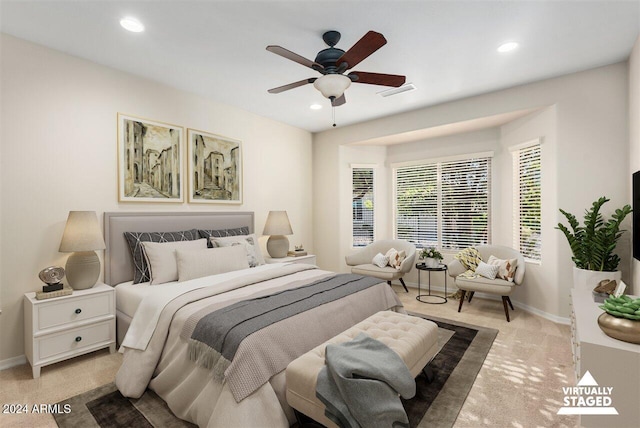 carpeted bedroom with ceiling fan