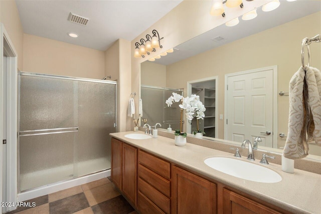 bathroom with vanity and walk in shower