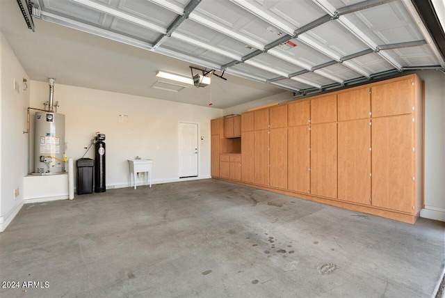 garage featuring a garage door opener and gas water heater