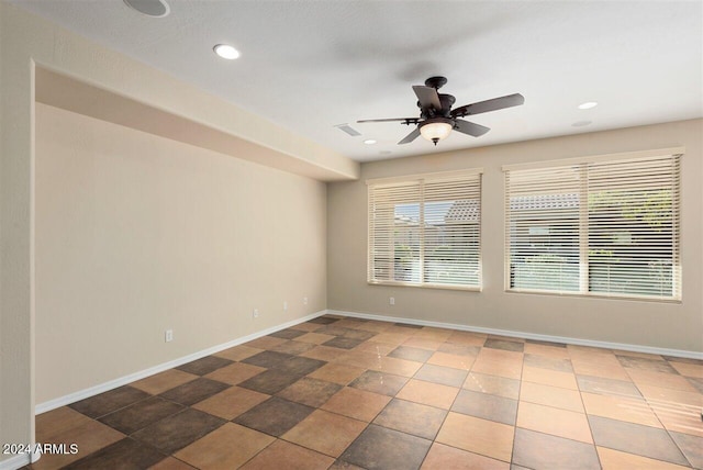 spare room featuring ceiling fan