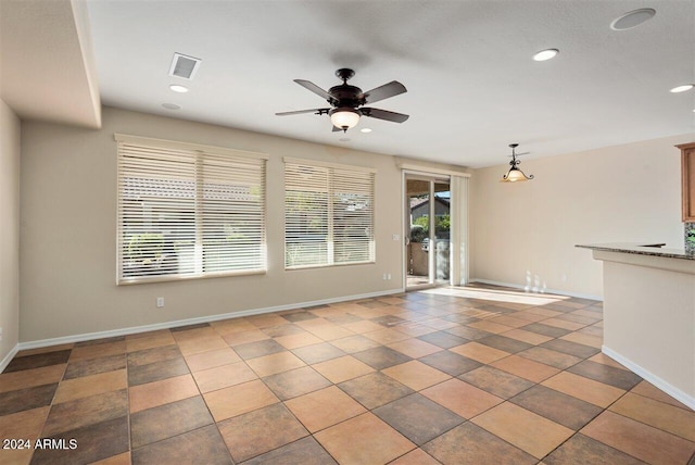 spare room featuring ceiling fan