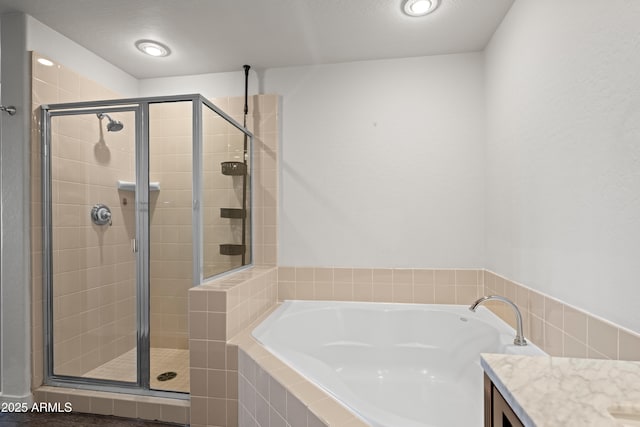17 W Vernon Ave Unit 412, Phoenix, AZ 85003 - bathroom with vanity, a bath, and a shower stall