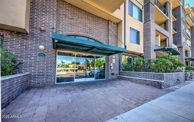 17 W Vernon Ave Unit 412, Phoenix, AZ 85003 - entrance to property featuring stucco siding and brick siding