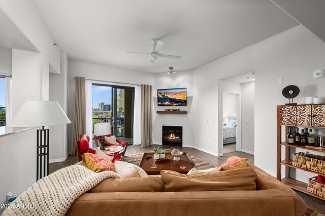 17 W Vernon Ave Unit 412, Phoenix, AZ 85003 - living room featuring a glass covered fireplace, baseboards, and ceiling fan