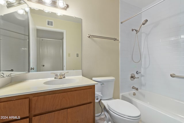 full bathroom with toilet, vanity, and tiled shower / bath combo