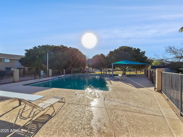 view of swimming pool featuring a patio area