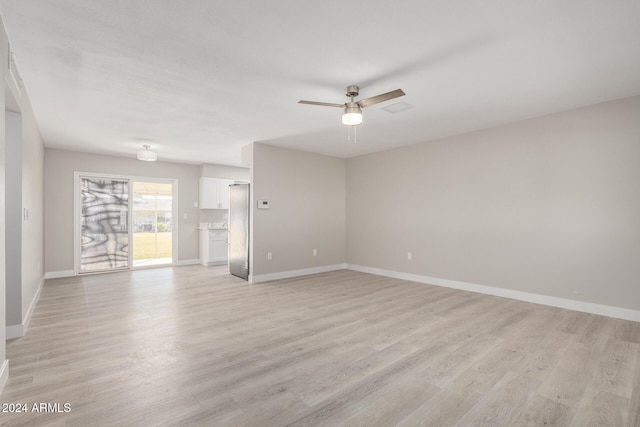 unfurnished room featuring ceiling fan and light wood-type flooring