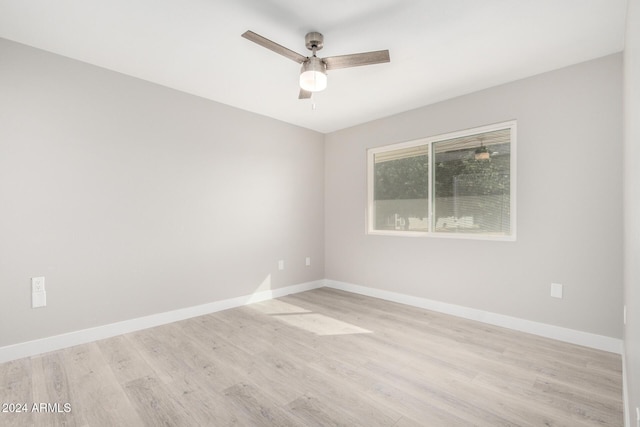 empty room with ceiling fan and light wood-type flooring