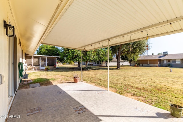 view of patio with a sunroom