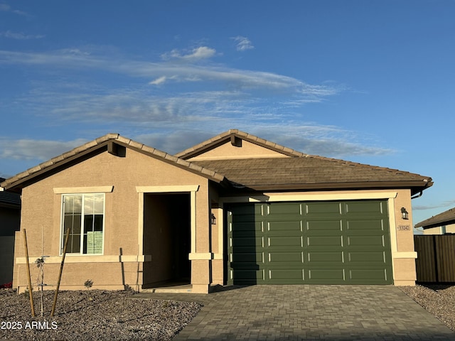 single story home featuring a garage